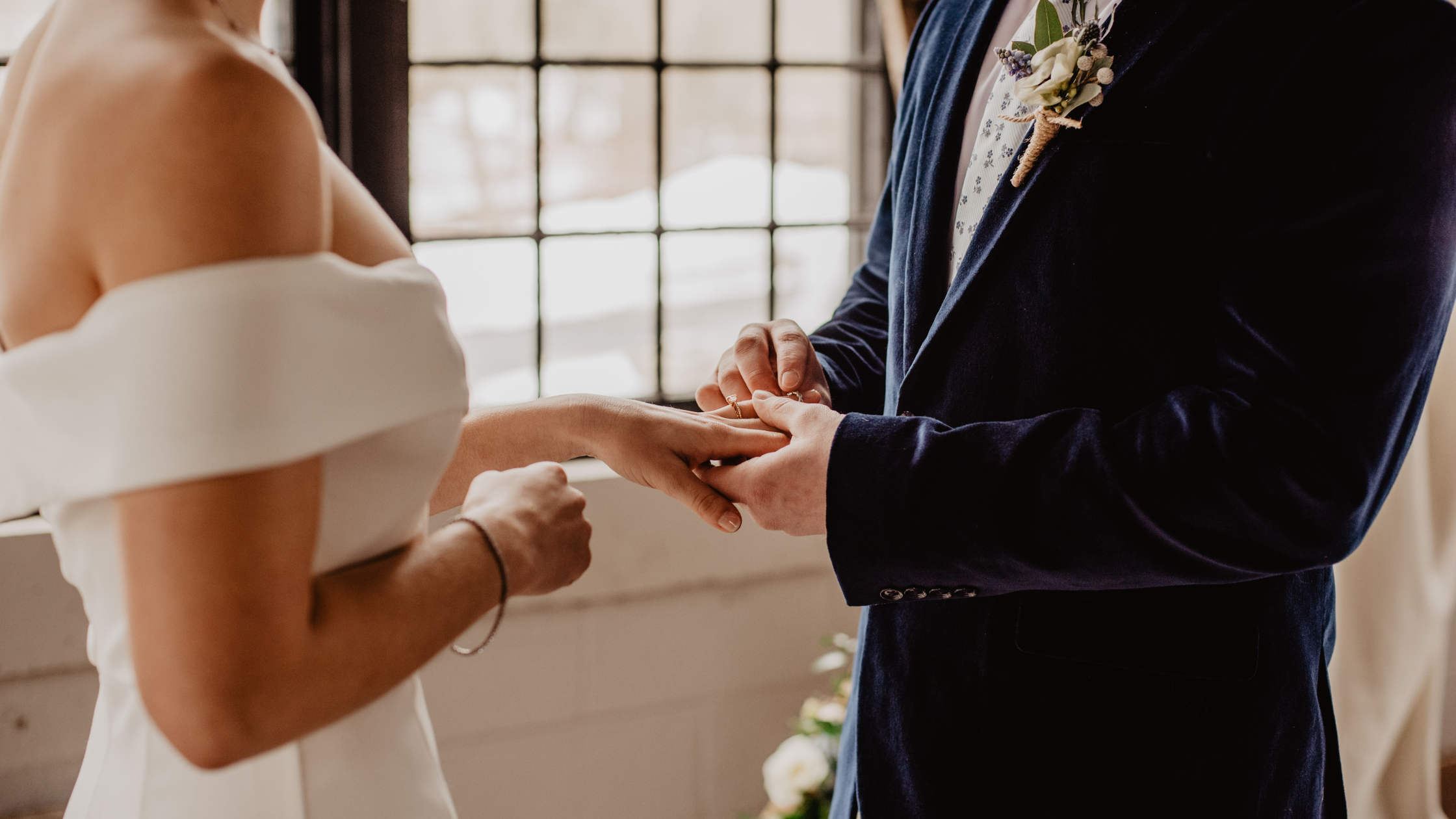 Happy couple exchanging rings, saying 