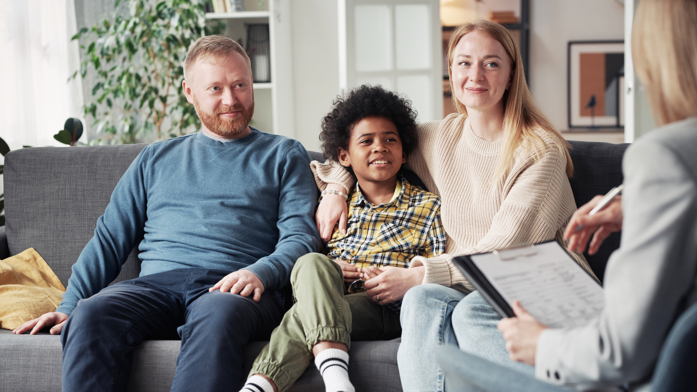 Co-parents and child on therapist's couch
