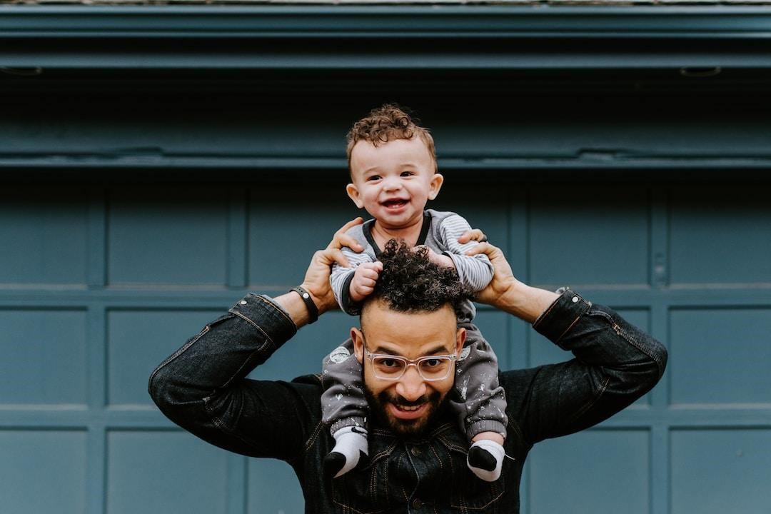 Father holding his son on his shoulders