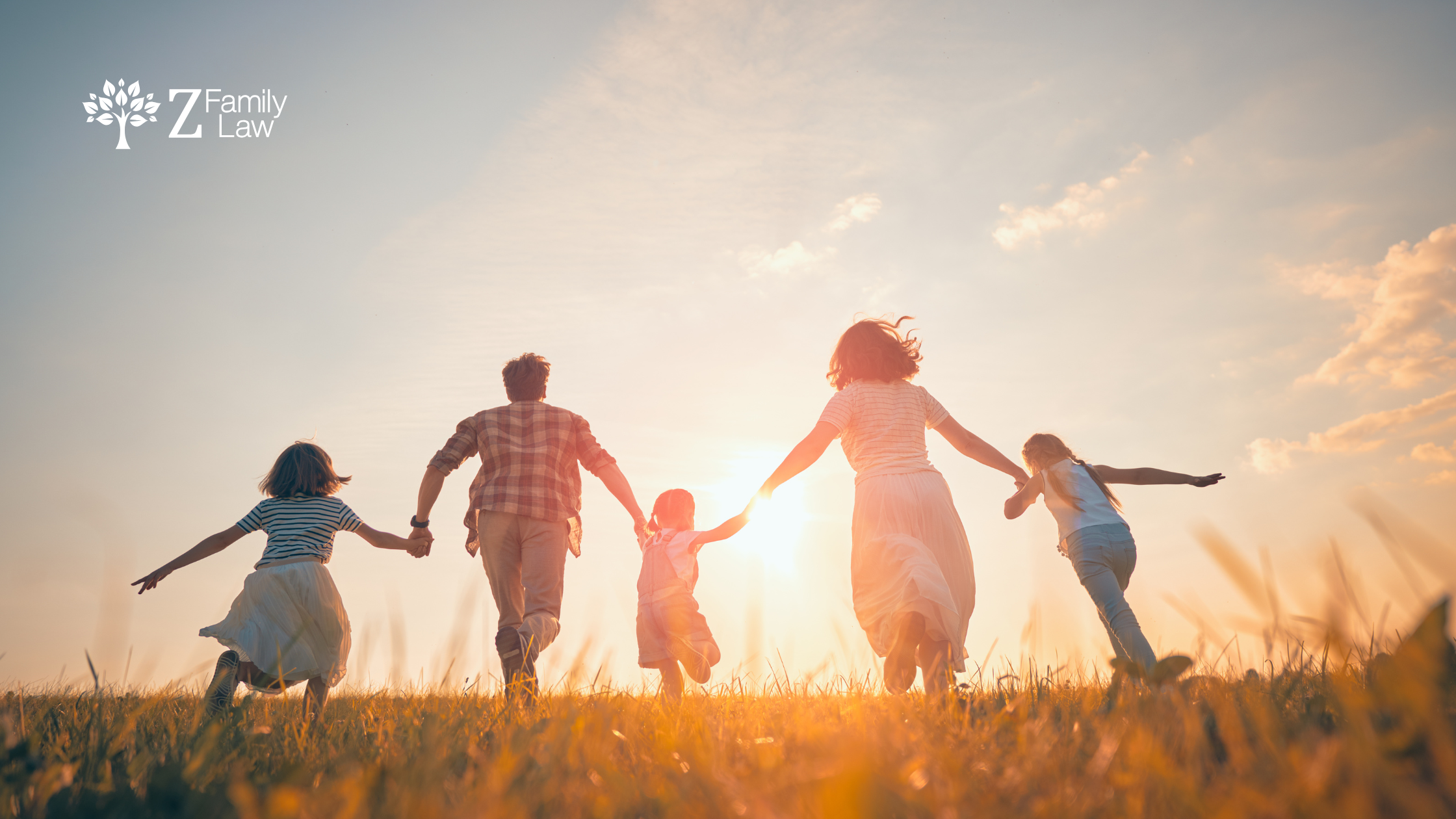 family running into sunset